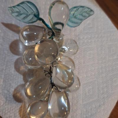 set of two vintage clusters of hand-blown clear glass grapes, one has green leaves one has clear.