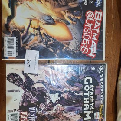 2 DC comic books in covers