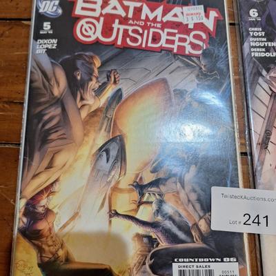 2 DC comic books in covers