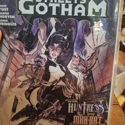 2 DC comic books in covers