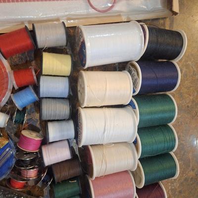 collection of assorted sewing and craft supplies.