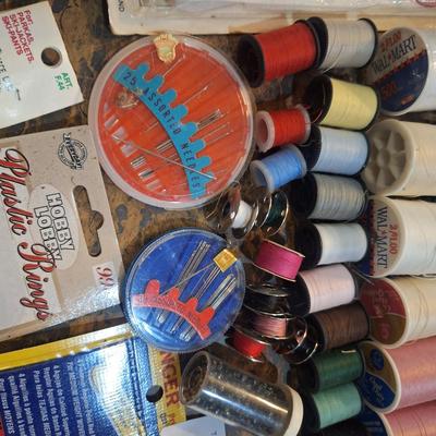collection of assorted sewing and craft supplies.