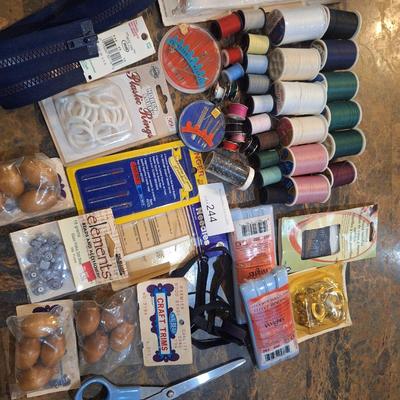 collection of assorted sewing and craft supplies.