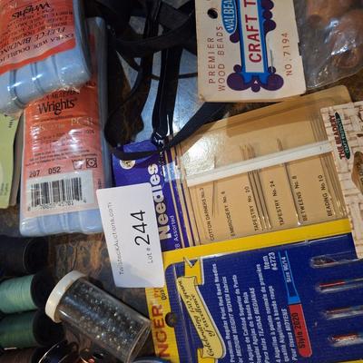 collection of assorted sewing and craft supplies.