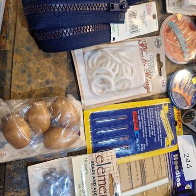 collection of assorted sewing and craft supplies.