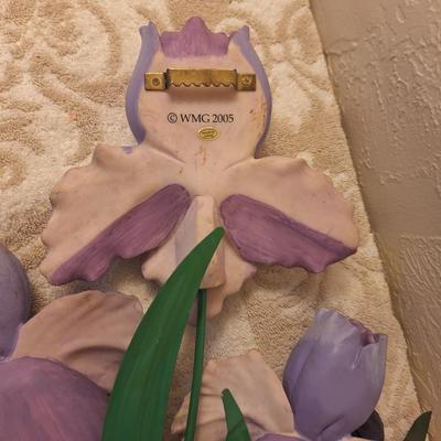 Metal and resin irisn wall hangings.