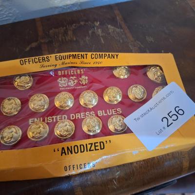 set of Officer's Equipment Company anodized gold buttons for a U.S. Marine Corps enlisted dress blue uniform
