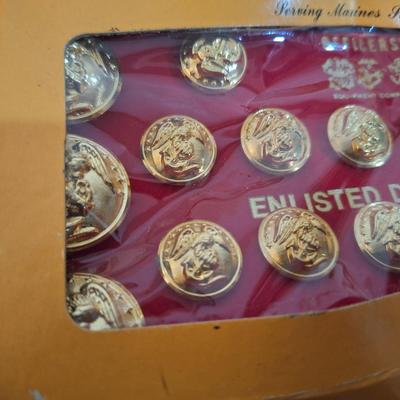 set of Officer's Equipment Company anodized gold buttons for a U.S. Marine Corps enlisted dress blue uniform