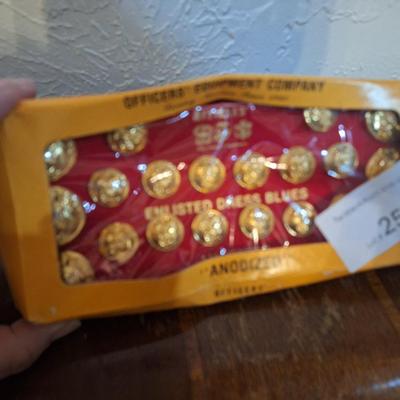 set of Officer's Equipment Company anodized gold buttons for a U.S. Marine Corps enlisted dress blue uniform