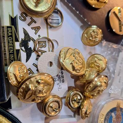 mixed lot of vintage and modern U.S. military uniform patches, pins, badges, and buttons