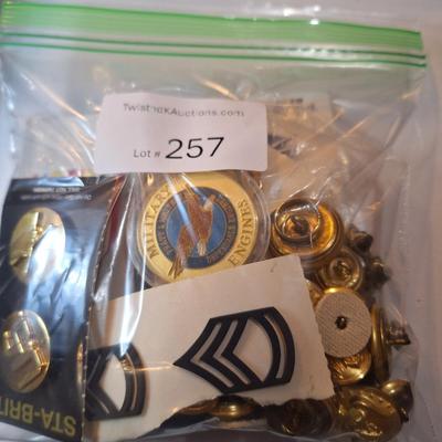 mixed lot of vintage and modern U.S. military uniform patches, pins, badges, and buttons