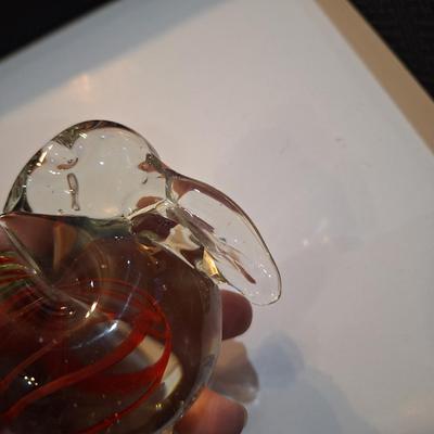 vintage, hand-blown art glass bunny rabbit paperweight with a red swirl design