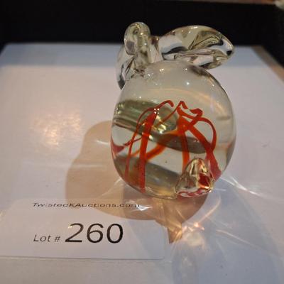 vintage, hand-blown art glass bunny rabbit paperweight with a red swirl design