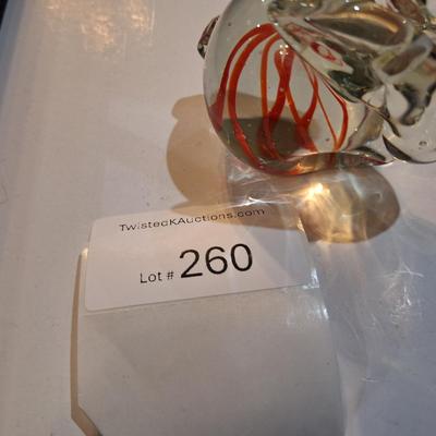 vintage, hand-blown art glass bunny rabbit paperweight with a red swirl design