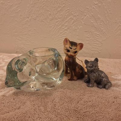 3 cat things, Indiana glass sleeping cat votive candle holder, porcelain cat with nine lives (mother only), and small resin cat