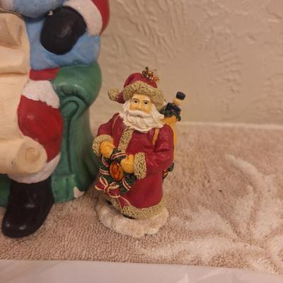 vintage ceramic Christmas figurine of Santa with two kids, and then two smaller Christmas items