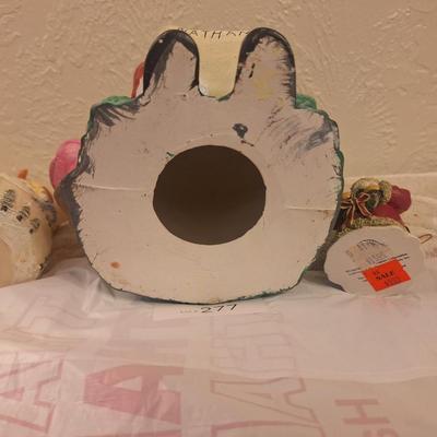 vintage ceramic Christmas figurine of Santa with two kids, and then two smaller Christmas items