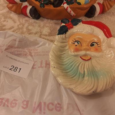 vintage ceramic santa clause candle holder and a flat ceramic dish- it has a chip on the eye
