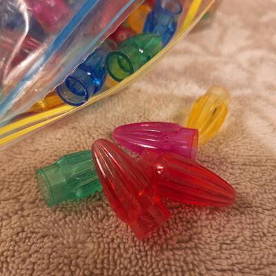 Christmass tree light peg ornaments for ceramic trees and some other kind of light pegs in the bag on the left.