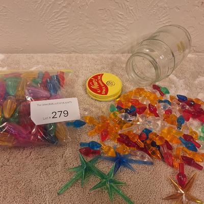 Christmass tree light peg ornaments for ceramic trees and some other kind of light pegs in the bag on the left.