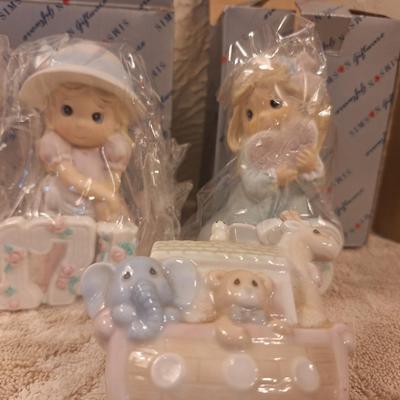 Precious moments or simlar figurines.