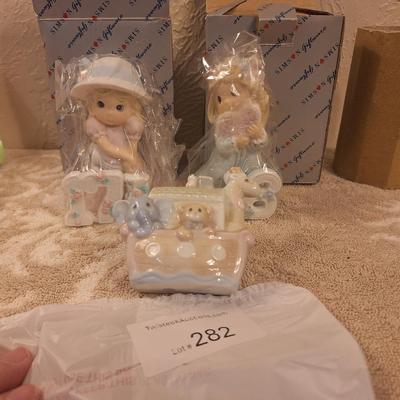 Precious moments or simlar figurines.