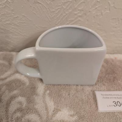 souvenir ceramic mug with the text "KENTUCKY WAS SO EXPENSIVE I COULD ONLY AFFORD HALF A CUP