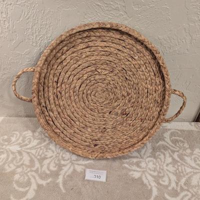 round woven seagrass or rattan decorative tray with handles.