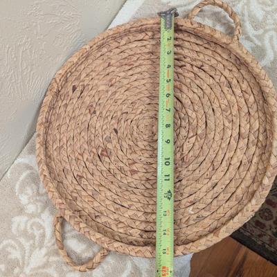 round woven seagrass or rattan decorative tray with handles.