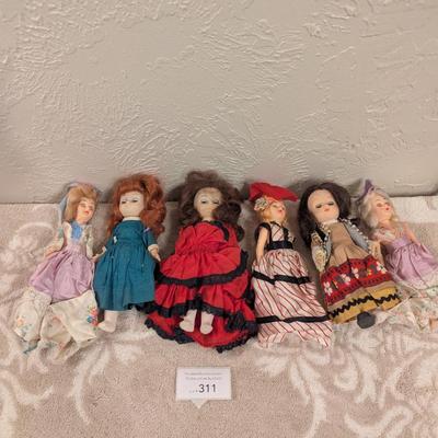 assortment of vintage dolls -