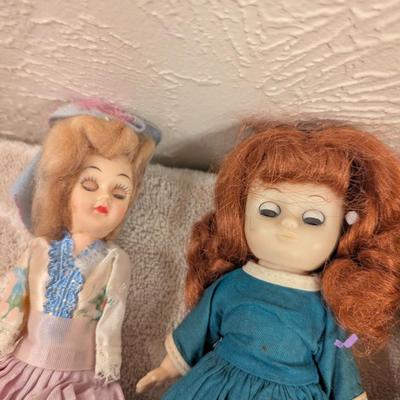 assortment of vintage dolls -