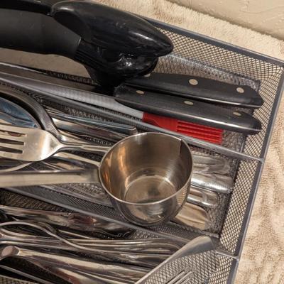 mesh steel organizer with flatware and serving utensils