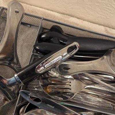 mesh steel organizer with flatware and serving utensils