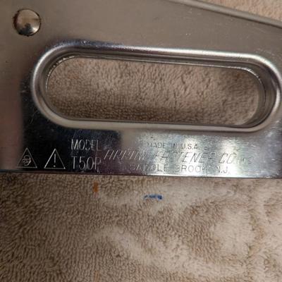 a couple of manual staple guns and a box of staples.