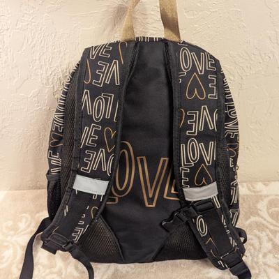 Cat & Jack 17" Love Print Kids' Backpack in black and gold.
