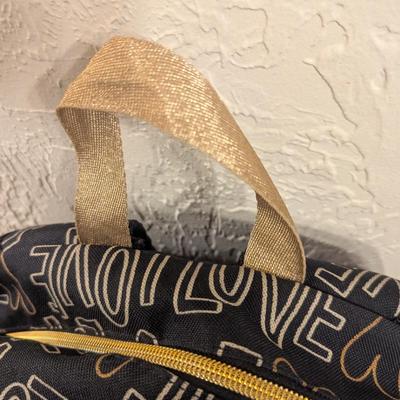 Cat & Jack 17" Love Print Kids' Backpack in black and gold.