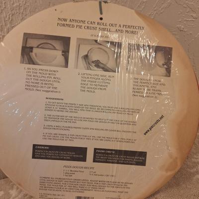 "Perfect-A-Crust" pie crust molds. The product is a patented dough cutting and forming device for 8, 9, and 10-inch pies