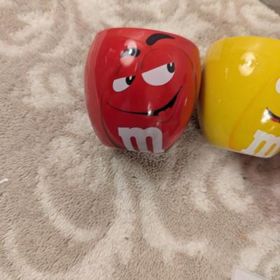 image shows a set of four M&M's character mugs and cups