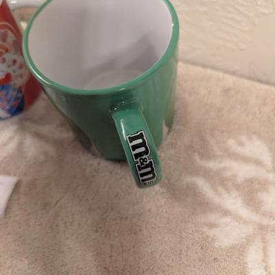 image shows a set of four M&M's character mugs and cups