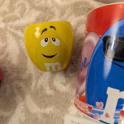 image shows a set of four M&M's character mugs and cups