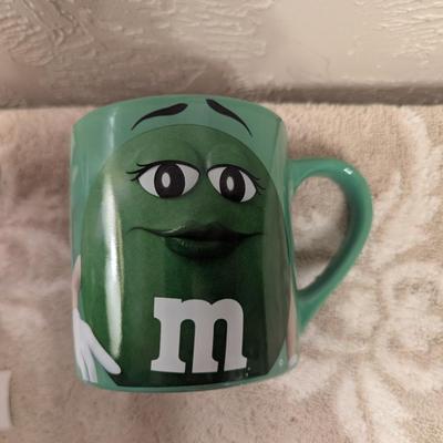 image shows a set of four M&M's character mugs and cups