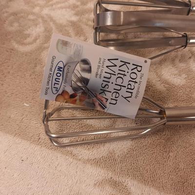 Mouli "The Incredible Rotary Kitchen Whisk" and another whisk