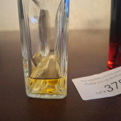  two bottles of fragrance products: Denim After Shave and Uroosa Eau de Parfum by Junaid Jamshed