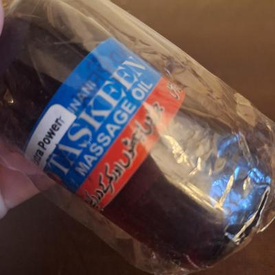  bottle of Taskeen (also known as Sukoon) massage oil, an Ayurvedic herbal oil used for pain relief.