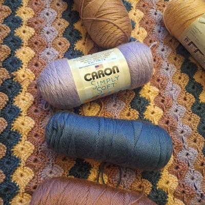 unfinished crocheted blanket, and the yard to use to finish it.