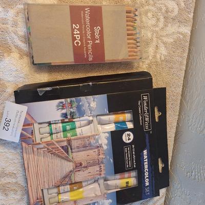 watercolor paints and pencils