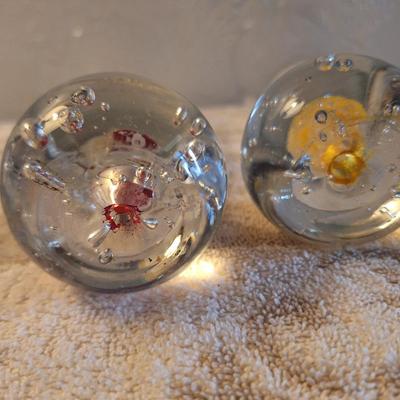 hand-blown art glass champagne flutes with a bubble ball base.