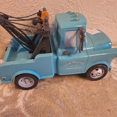  Disney Pixar Cars Tow Mater toy. This is a larger toy the auction sticker is 2 inches wide if that helps for size comparison