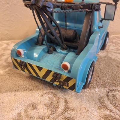  Disney Pixar Cars Tow Mater toy. This is a larger toy the auction sticker is 2 inches wide if that helps for size comparison