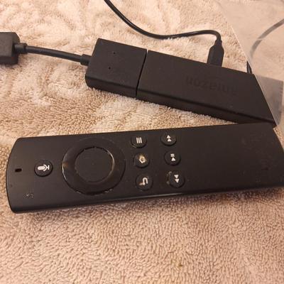 Amazon Fire TV Stick streaming device and remote
